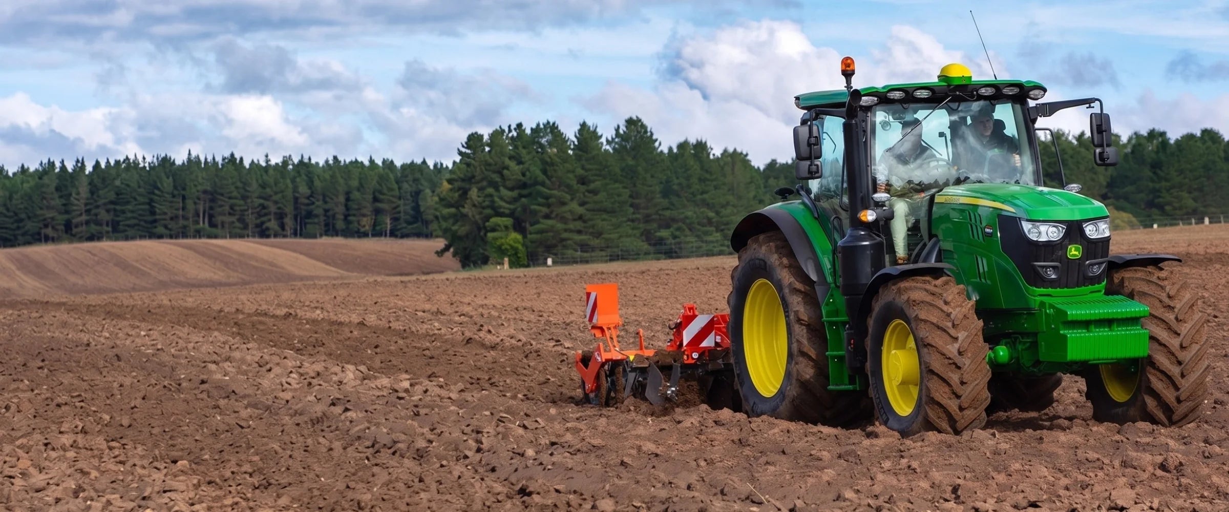 John Deere 6R Series tractor tilling a field