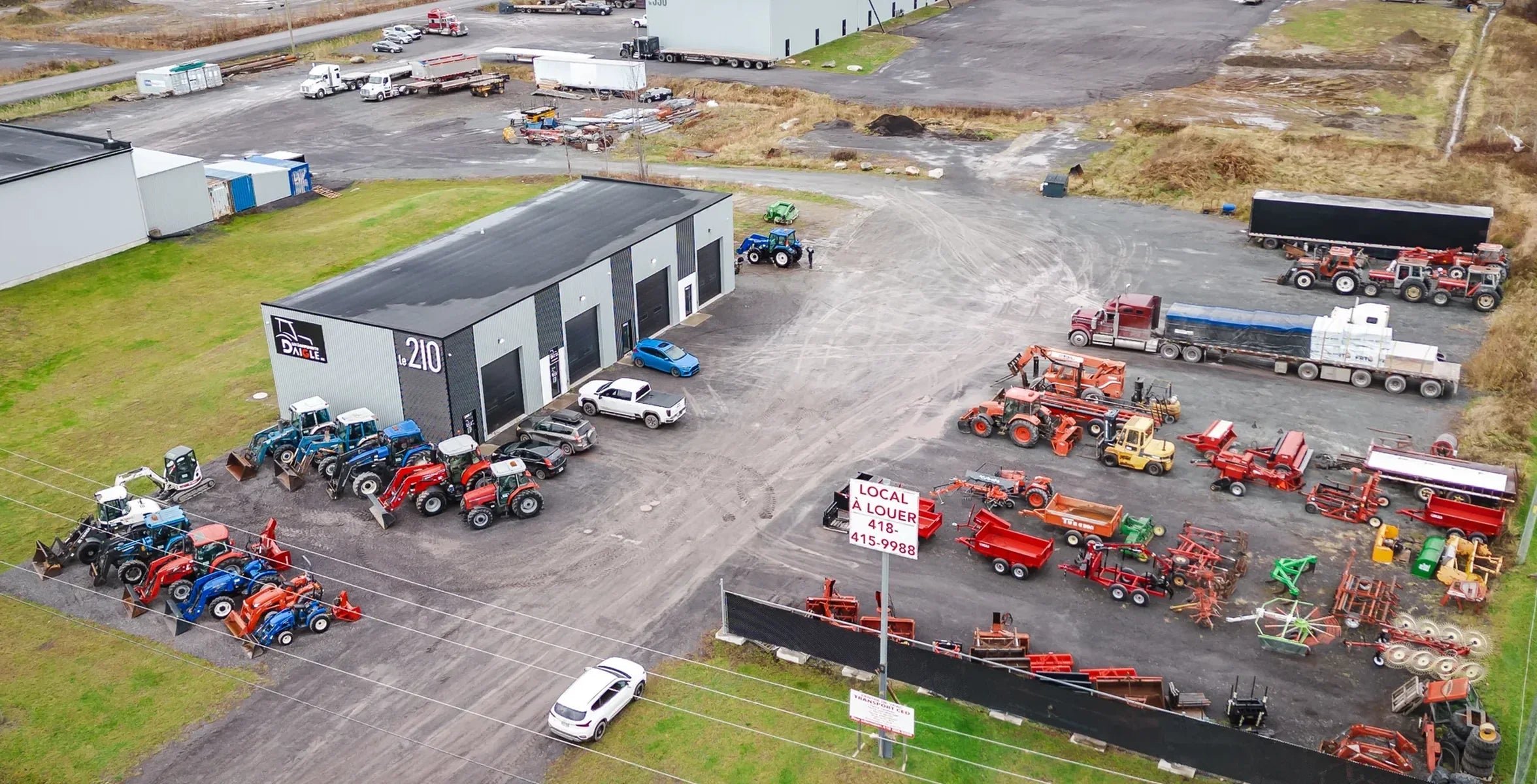 Aerial view of the Équipements Daigle yard in Issoudun, with tractors and equipment in inventory