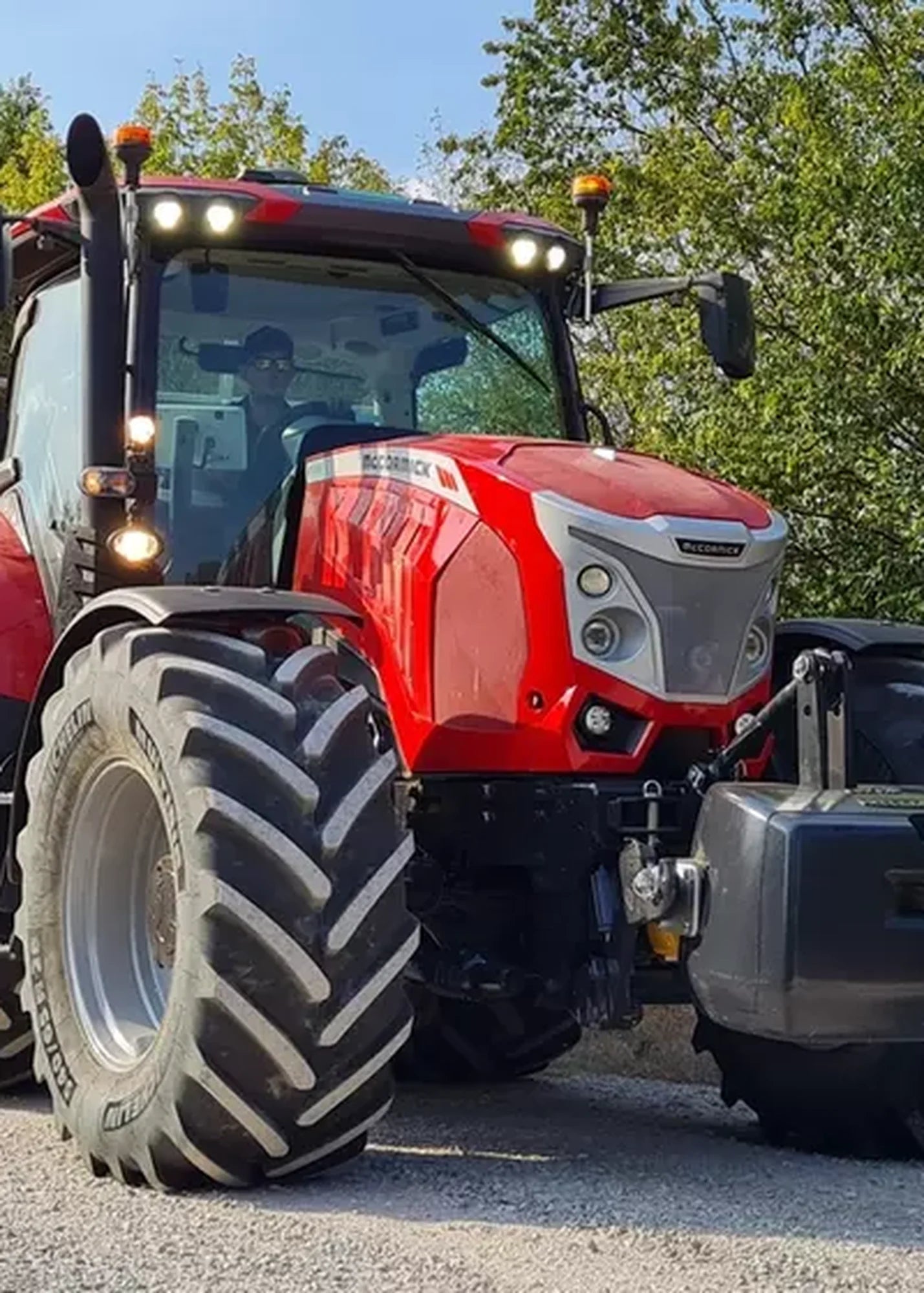 Red McCormick X7 tractor on a farm road