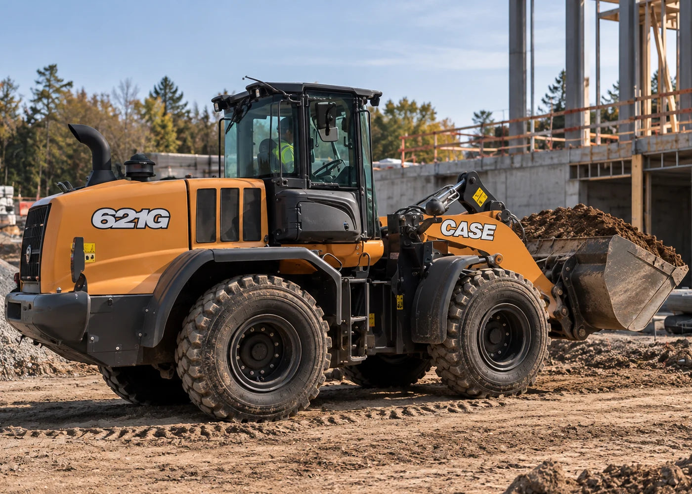 Case 621G wheel loader on a job site, bucket loaded with dirt