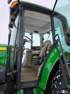 Cab interior of used John Deere 7330 tractor with operator seat – Quebec