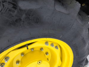 Rear agricultural tire and yellow wheel on John Deere 7330 tractor – used – Quebec
