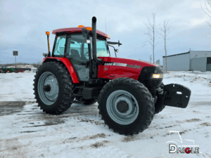 Front view of the Case IH MXM120 tractor showing the hood, headlights and agricultural tires.