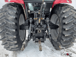 Rear view of the Case IH MXM120 tractor showing the three-point hitch and hydraulic connections.