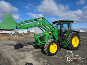 John Deere 5100M tractor with raised front loader in good condition