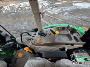 John Deere 5115M control console with levers and hydraulic controls