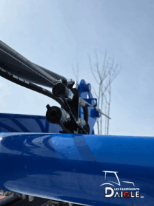 Close-up of New Holland loader hydraulic connections