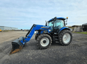 Blue 2012 New Holland T6020 tractor with front loader parked at Les Équipements Daigle Inc.