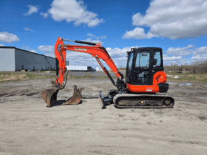 2021 Kubota KX057-4 excavator left side view with two included buckets.