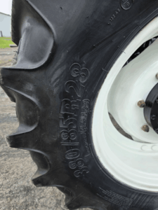 Front tire size detail on the New Holland T6020 tractor.