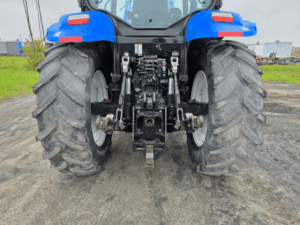 Rear hydraulic outlets and hitch assembly on the New Holland T6020 tractor.