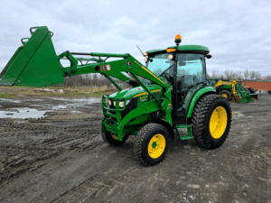 John Deere 4066R loader raised front right view