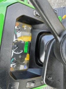 Dashboard of a John Deere 5075E tractor displaying operating hours.