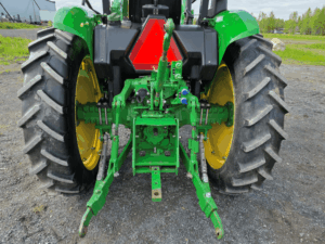Close-up of the three-point hitch on a John Deere 5075E tractor