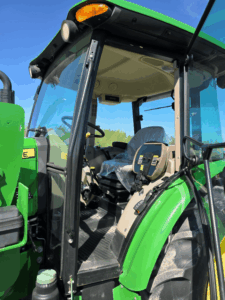 Interior cab entrance of the 2019 John Deere 5075E tractor.