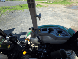Right-side control console inside the 2019 John Deere 5075E tractor cab.