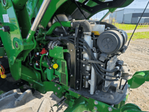 Open engine compartment on the 2019 John Deere 5075E tractor.