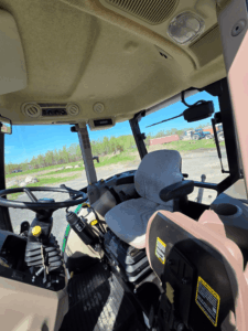 Interior cab and operator seat of the 2019 John Deere 5075E tractor