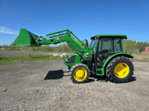 Side view of the 2019 John Deere 5075E tractor with front loader.