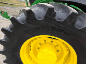 Agricultural tire size on the John Deere 6155R tractor.