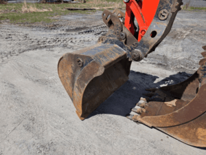 Trenching bucket mounted on the 2021 Kubota KX057-4 excavator.
