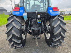 Three-point hitch and hydraulic outlets on a New Holland TD95D tractor.