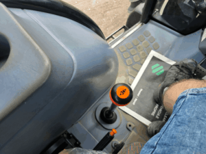 PTO controls and auxiliary controls on a New Holland TD95D tractor.