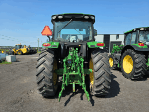 Rear view of a 2019 John Deere 6130R tractor with three-point hitch.