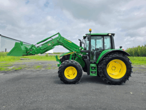 Left side profile of a 2021 John Deere 6120M tractor with 620R front loader