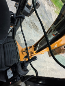 Rear backhoe controls inside the Case 580 Super N WT cab