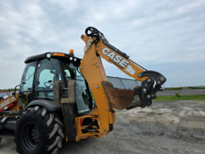 Case 580 Super N WT excavator arm and quick coupler