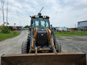 Front view of a Case 580 Super N WT backhoe loader with loader bucket
