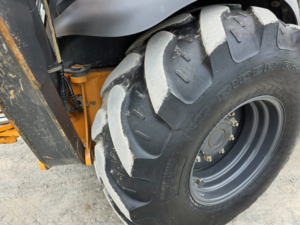 Rear industrial tire on a Case 580 Super N WT backhoe loader