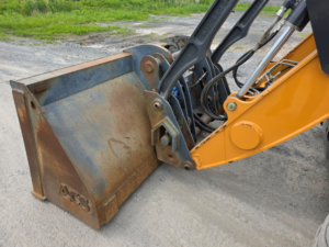Godet avant de la rétrocaveuse Case 580 Super N WT