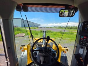 Operator's view from the cab of a John Deere 524P wheel loader