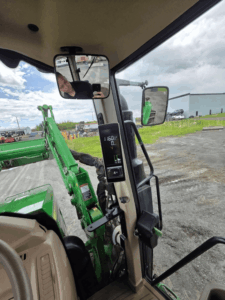 Digital display showing operating information on a 2020 John Deere 6110M tractor.