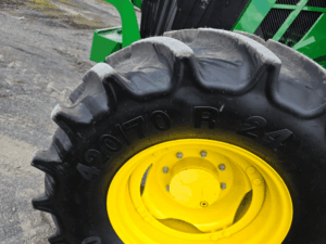 420/70R24 front tire on a 2020 John Deere 6110M tractor.