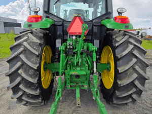 Three-point hitch and hydraulic outlets on a 2020 John Deere 6110M tractor.