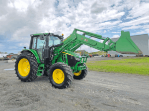 2020 John Deere 6110M tractor with enclosed cab and front loader.