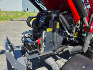 Massey Ferguson 1758H engine compartment open for inspection