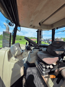 Massey Ferguson 6616 cab interior with steering wheel and dashboard