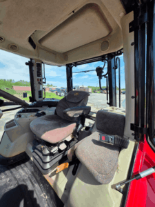 Operator seat inside Massey Ferguson 6616 tractor cab