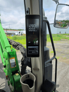 Hour meter showing 663 hours on a 2021 John Deere 6120M tractor