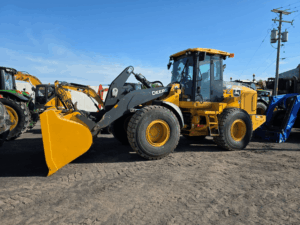 Used 2021 John Deere 524P wheel loader for sale with enclosed cab and high-capacity bucket at Les Équipements Daigle in Quebec