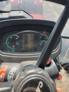 Instrument cluster of a 2014 Case IH Farmall 105U tractor showing 3,025.9 operating hours