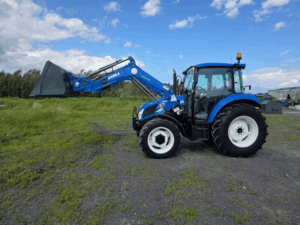 Left side view of the 2016 New Holland T4.75 tractor with front loader