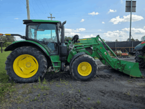 Side view of a 2017 John Deere 6110R tractor with 640R loader