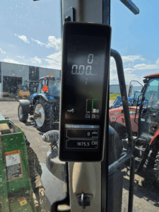 Digital display of a 2021 John Deere 6110M tractor showing 1,875.5 hours