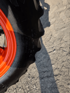 Front tire of the 2019 Kubota M5-111 tractor in excellent condition at Les Équipements Daigle