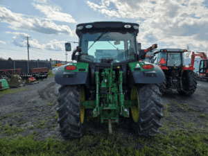 Rear view of a 2017 John Deere 6110R tractor with three-point hitch